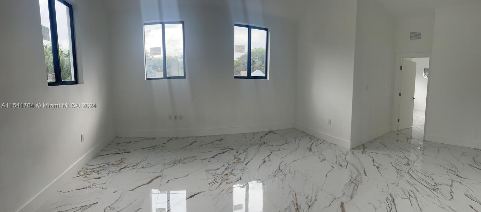 5455 Southwest 60th Court Miami, FL 33155 - Photo 26 of 68 an empty room with windows