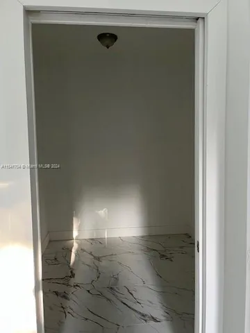 a view of a room with rack on the wall