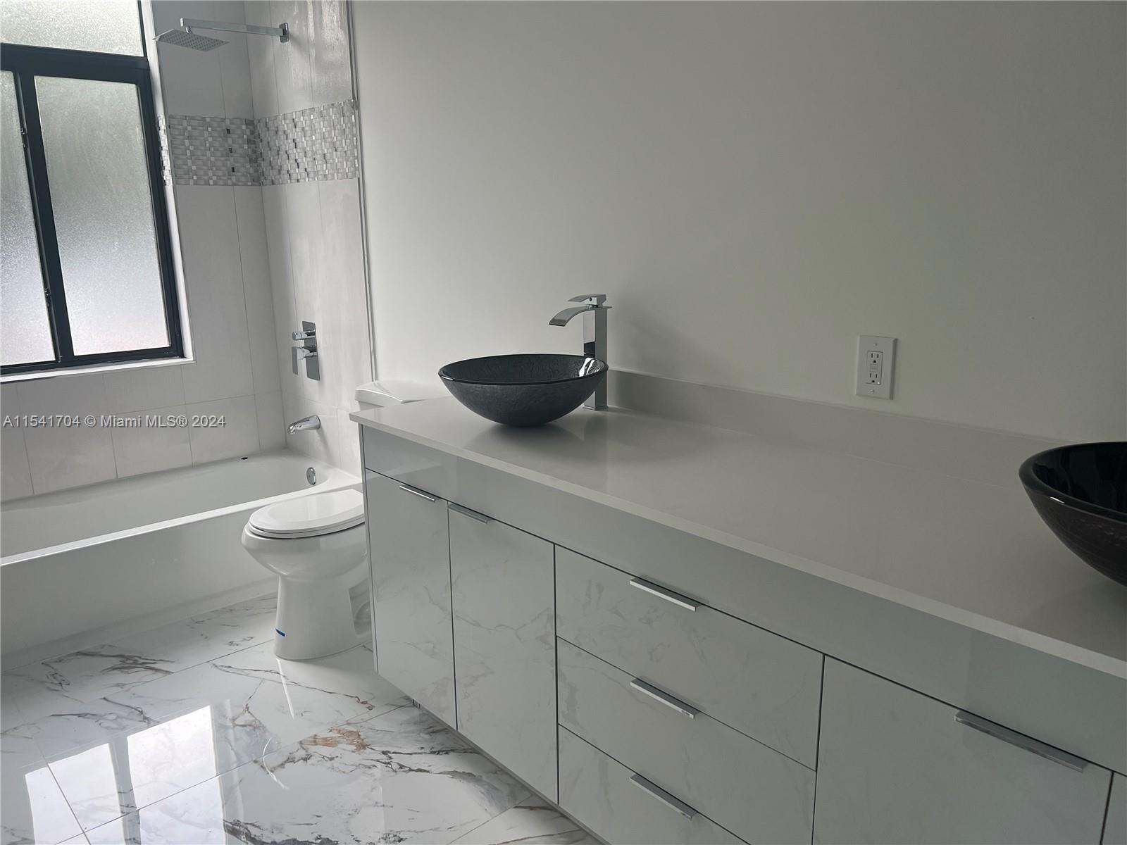 5455 Southwest 60th Court Miami, FL 33155 - Photo 51 of 68 a bathroom with a granite countertop sink a toilet and a mirror