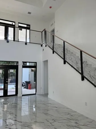 a view of room with a ceiling fan and window
