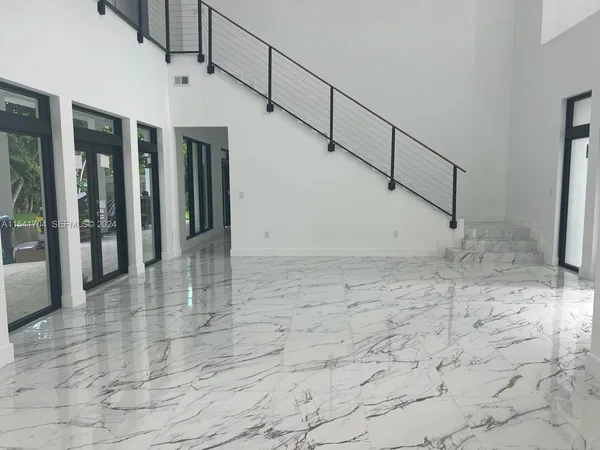 a kitchen with stainless steel appliances granite countertop a sink and cabinets