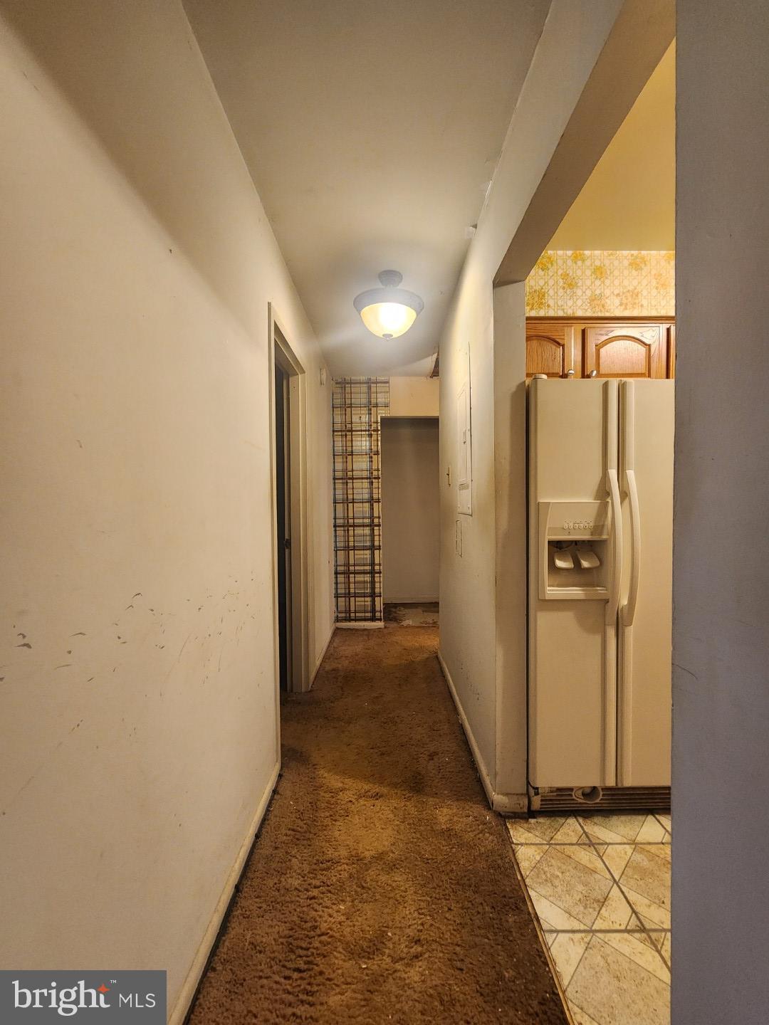 10135 Prince Place, Unit 1036A Upper Marlboro, MD 20774 - Photo 11 of 16 a view of a hallway with wooden shelves