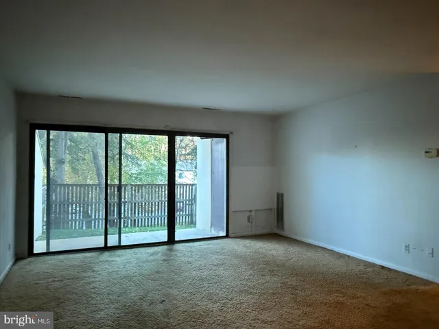 an empty room with sliding door