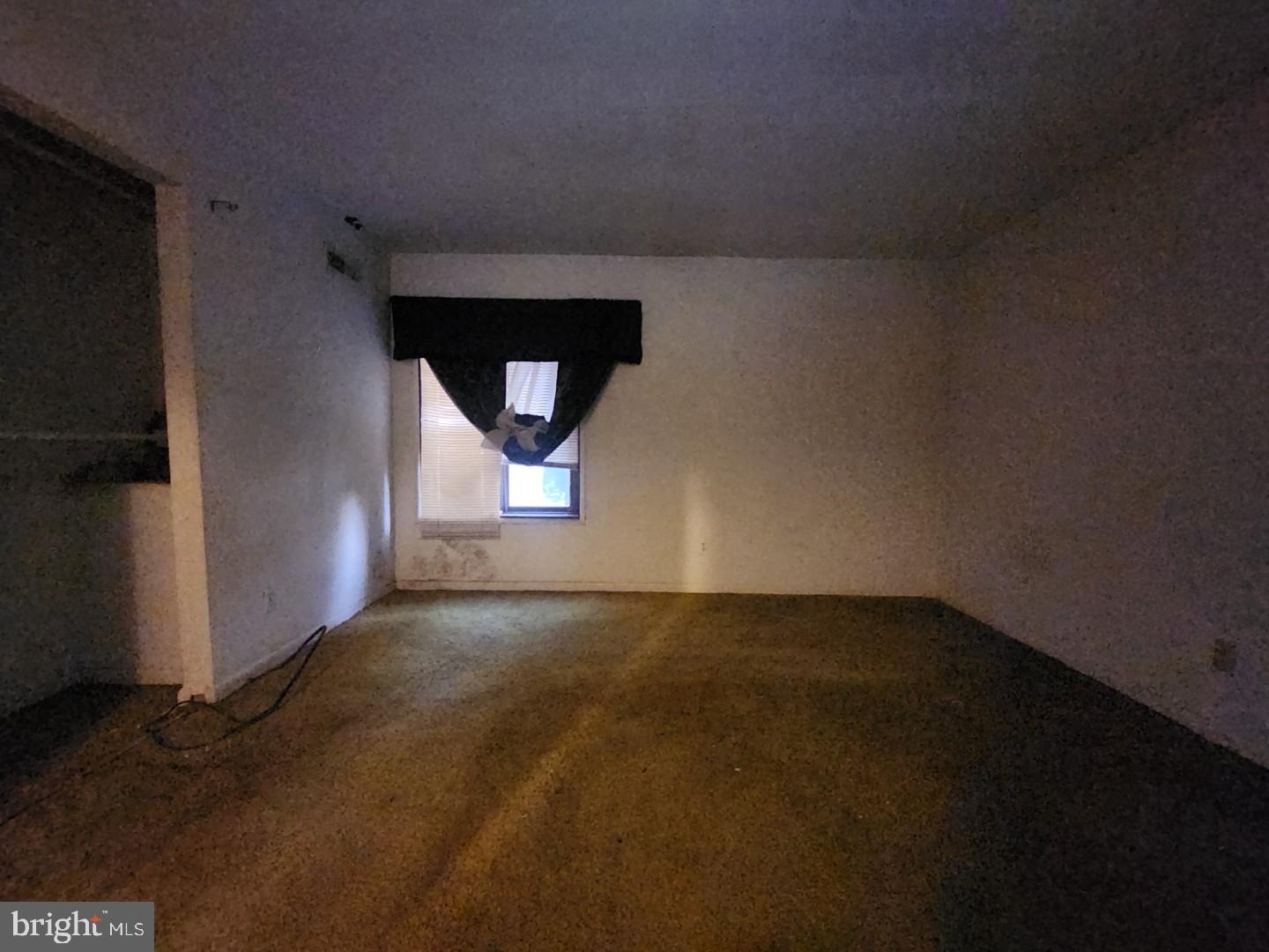 10135 Prince Place, Unit 1036A Upper Marlboro, MD 20774 - Photo 13 of 16 a view of an empty room with a window