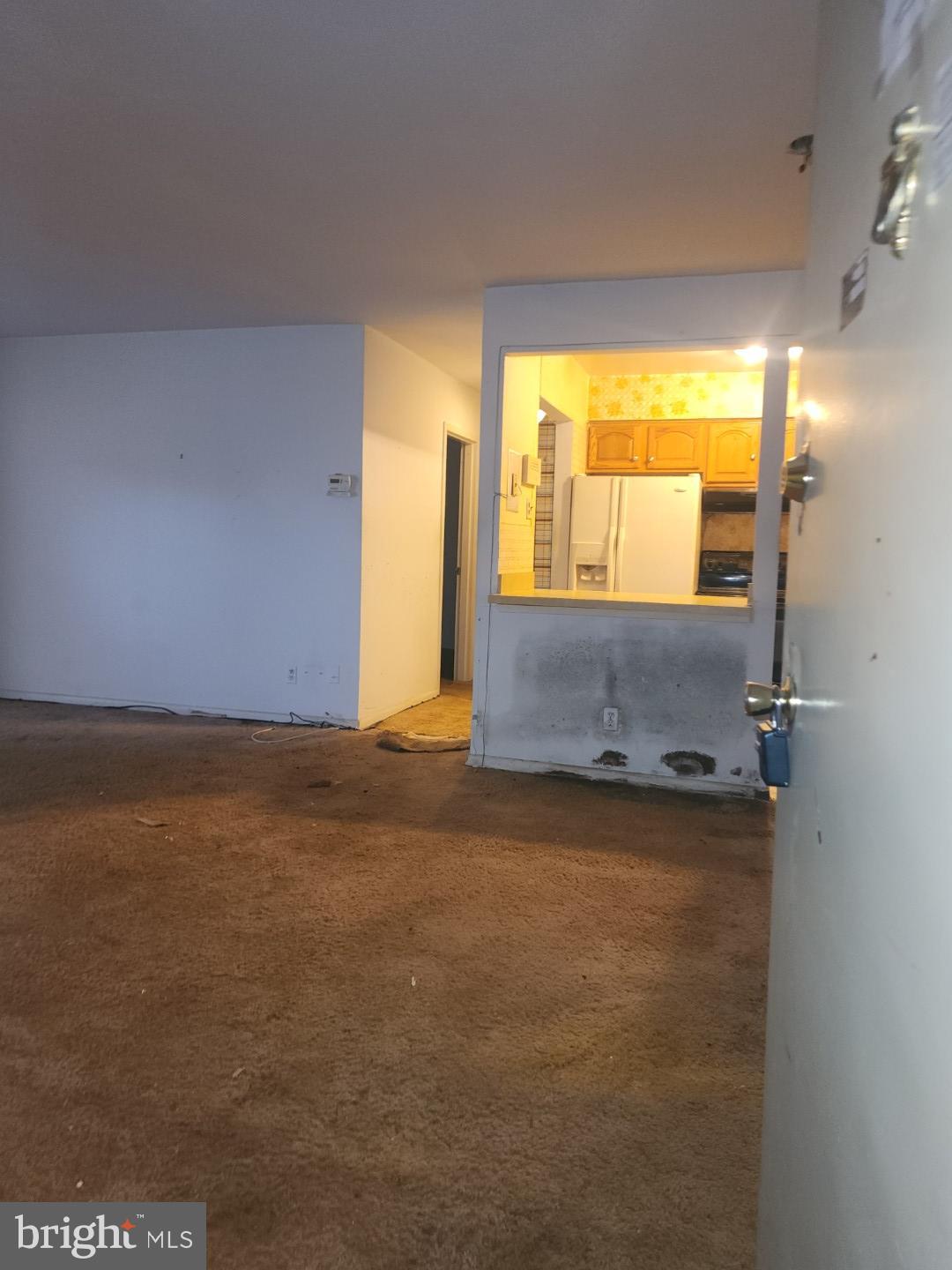 10135 Prince Place, Unit 1036A Upper Marlboro, MD 20774 - Photo 3 of 16 an empty room with a window