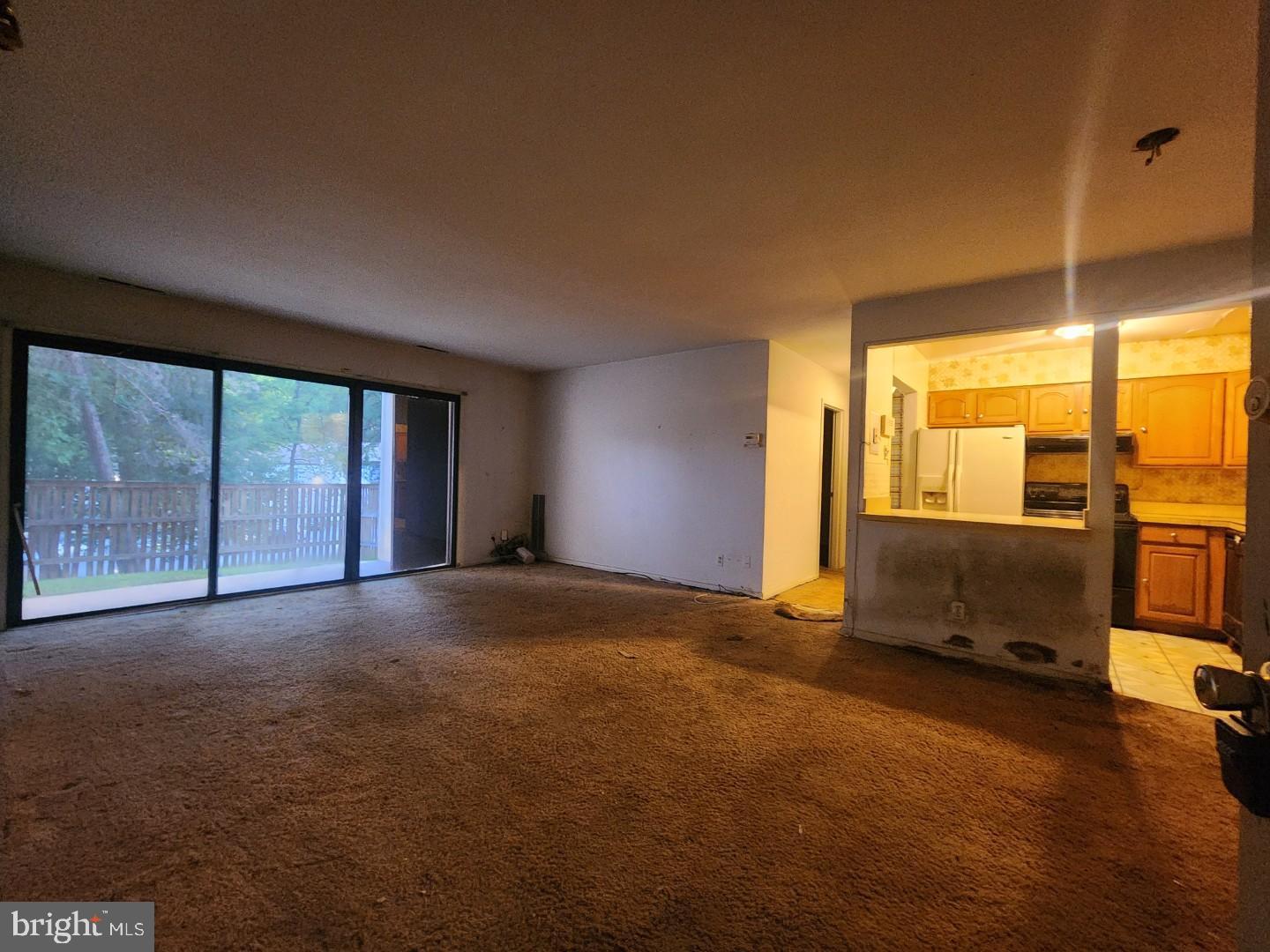 10135 Prince Place, Unit 1036A Upper Marlboro, MD 20774 - Photo 4 of 16 a view of an empty room with a window