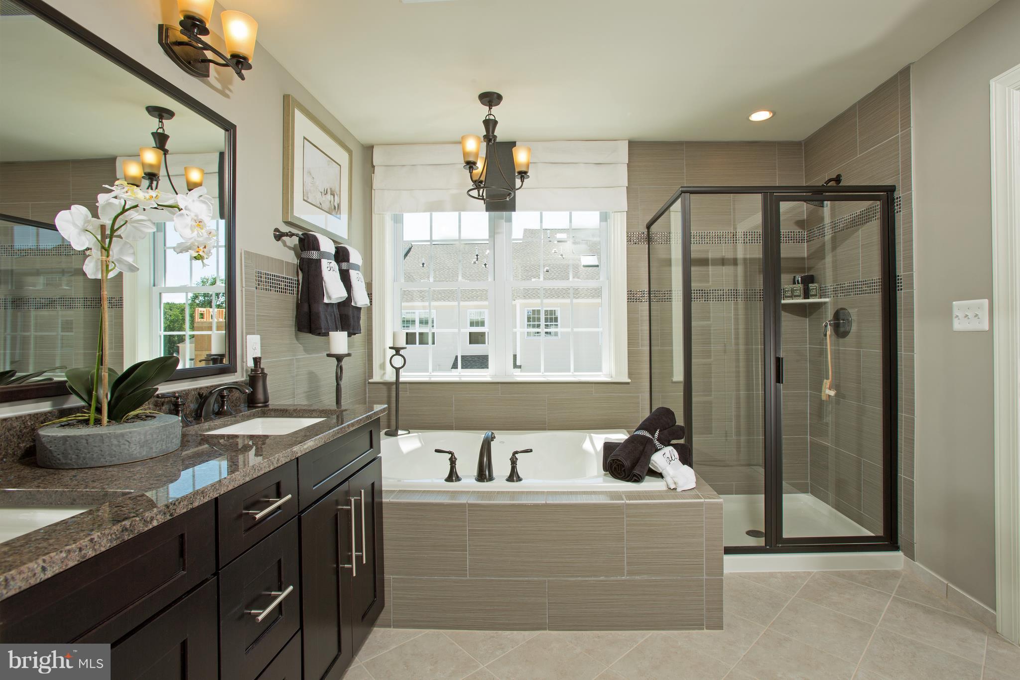 2603 Maple Rock Road Hanover, MD 21076 - Photo 14 of 22 a spacious bathroom with a granite countertop tub sink and mirror