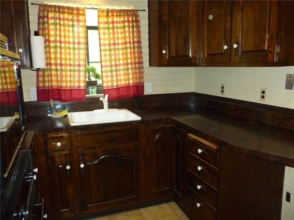 28 Kenridge Drive McKees Rocks, PA 15136 - Photo 11 of 26 a kitchen with a sink and cabinets
