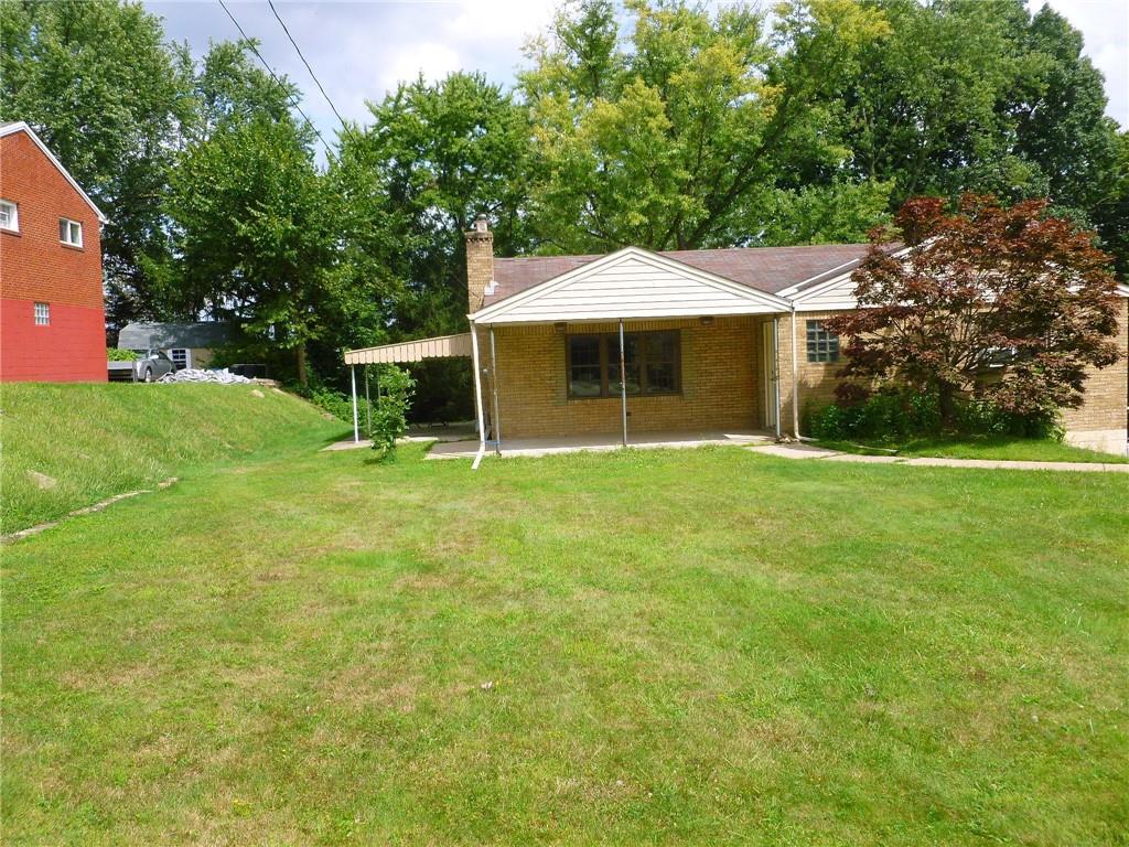 28 Kenridge Drive McKees Rocks, PA 15136 - Photo 25 of 26 a view of a house with a yard and sitting area