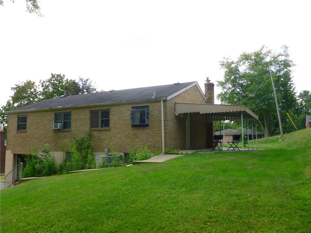 28 Kenridge Drive McKees Rocks, PA 15136 - Photo 3 of 26 a view of a house with a yard and sitting area