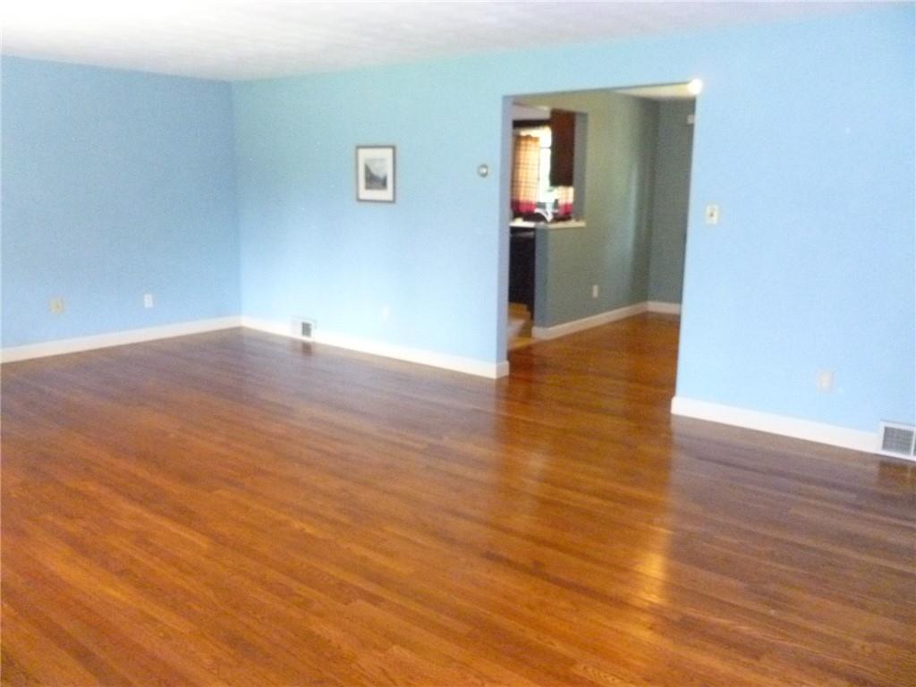 28 Kenridge Drive McKees Rocks, PA 15136 - Photo 7 of 26 wooden floor in an empty room