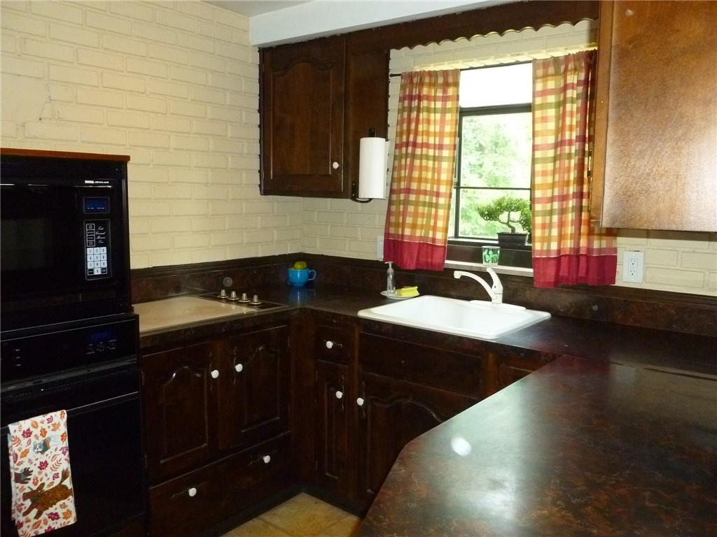 28 Kenridge Drive McKees Rocks, PA 15136 - Photo 10 of 26 a kitchen with a sink and cabinets