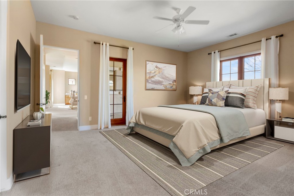 860 Vista Del Rio Nipomo, CA 93444 - Photo 16 of 45 a bedroom with a bed and glass windows