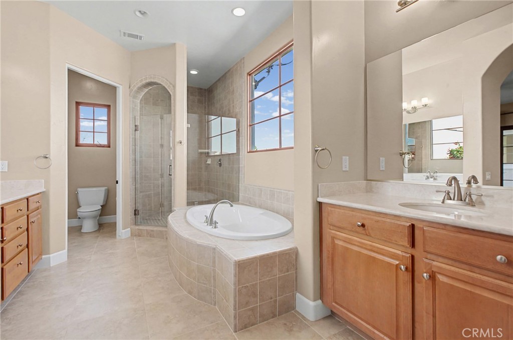 860 Vista Del Rio Nipomo, CA 93444 - Photo 23 of 45 a spacious bathroom with a sink a mirror and a bathtub