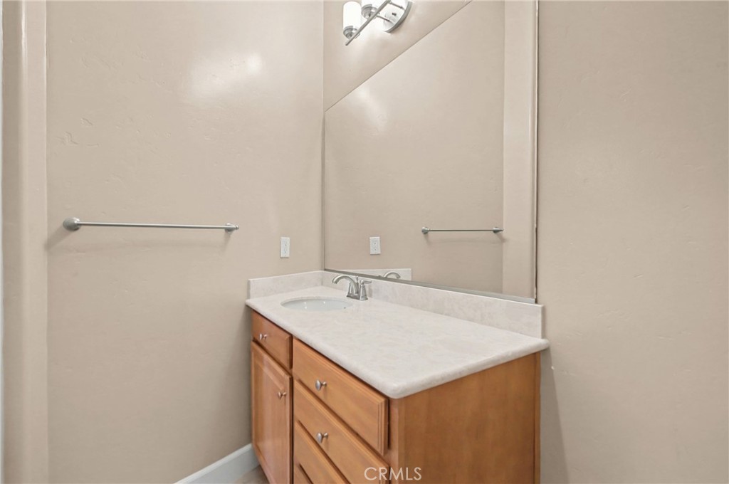 860 Vista Del Rio Nipomo, CA 93444 - Photo 27 of 45 a bathroom with a sink and a mirror