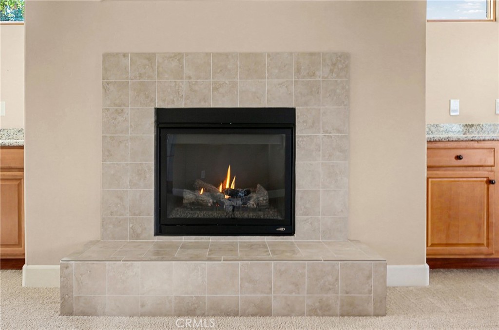860 Vista Del Rio Nipomo, CA 93444 - Photo 6 of 45 a fireplace with a painting on the wall