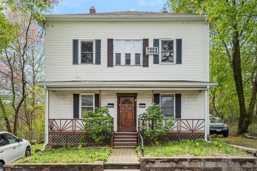 511 Beech Street Boston, MA 02131 - Photo 1 of 14 a front view of a house with garden