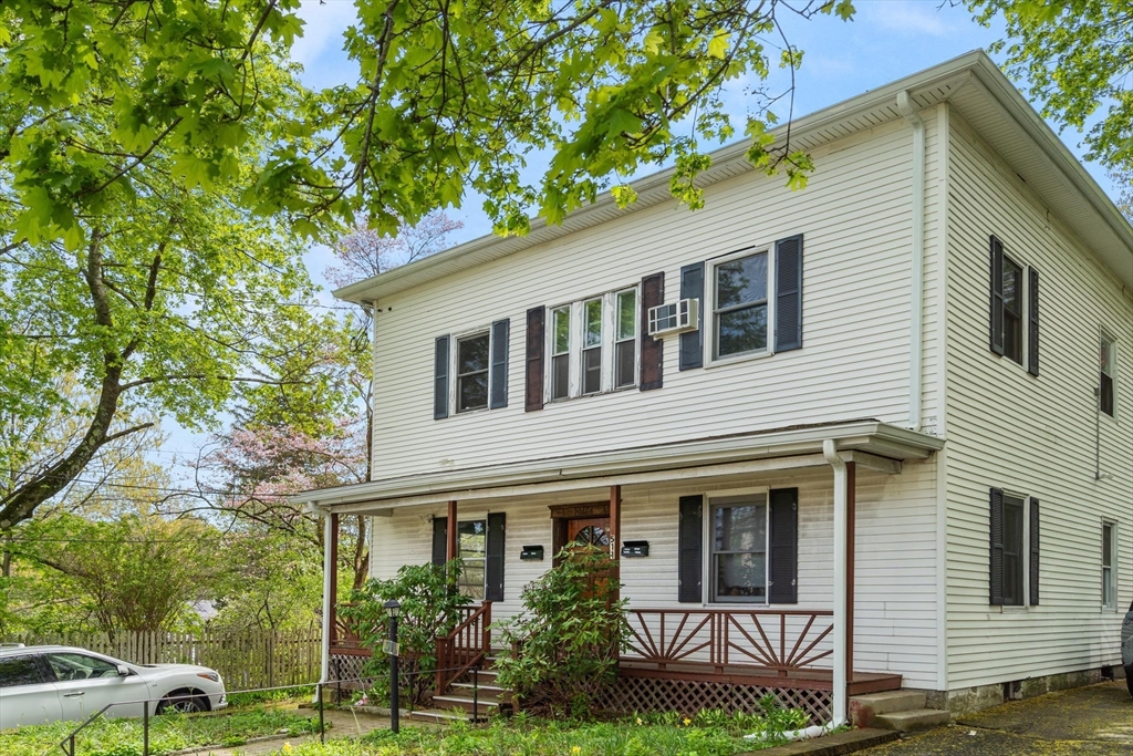 511 Beech Street Boston, MA 02131 - Photo 2 of 14 a house that has a tree in front of the house