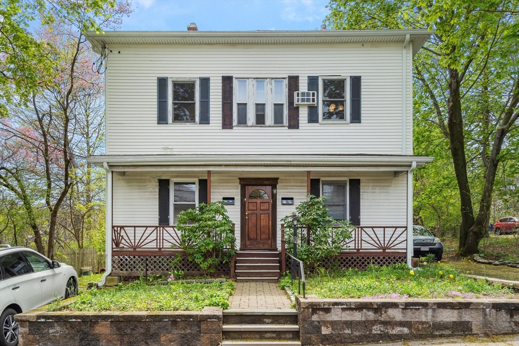 511 Beech Street Boston, MA 02131 - Photo 3 of 14 a front view of a house with a yard