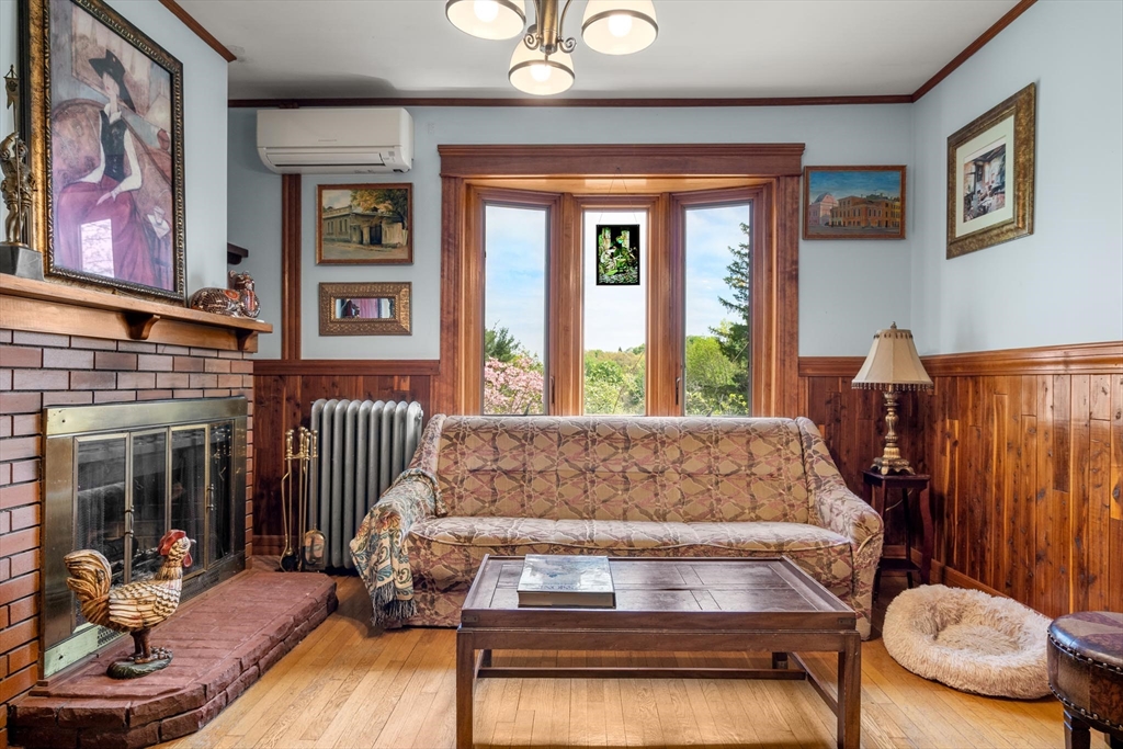 511 Beech Street Boston, MA 02131 - Photo 4 of 14 a living room with furniture and a fireplace