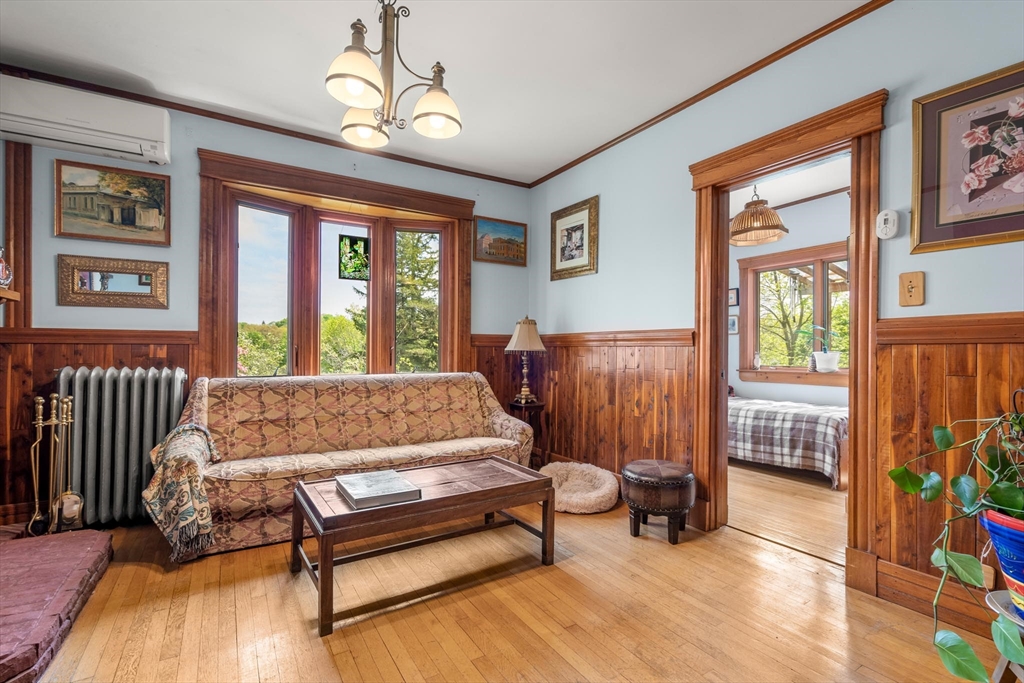 511 Beech Street Boston, MA 02131 - Photo 5 of 14 a bedroom with furniture and a window