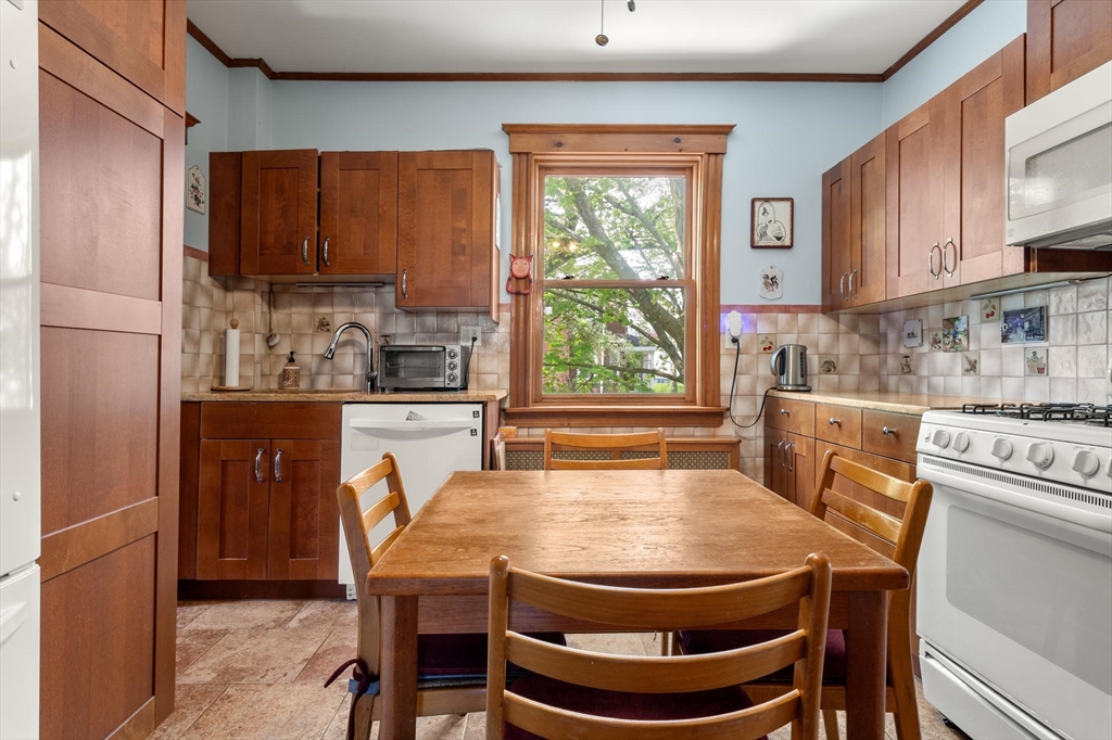 511 Beech Street Boston, MA 02131 - Photo 7 of 14 a dining room with furniture and window