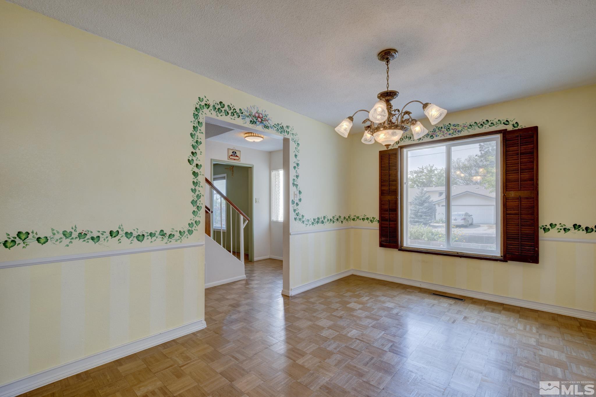 1700 O Farrell Street Reno, NV 89503 - Photo 11 of 22 wooden floor in an empty room with a window