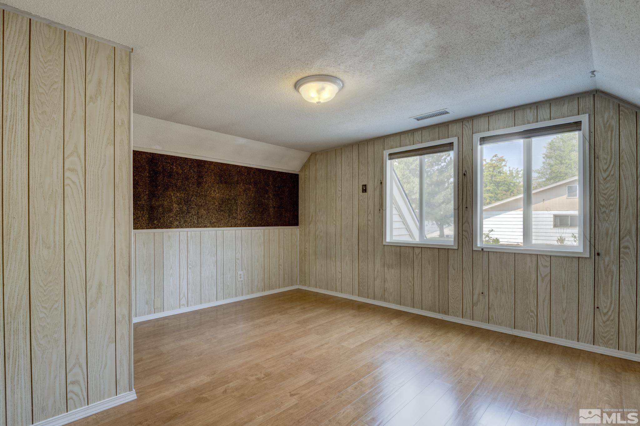 1700 O Farrell Street Reno, NV 89503 - Photo 14 of 22 a view of an empty room with wooden floor and a window