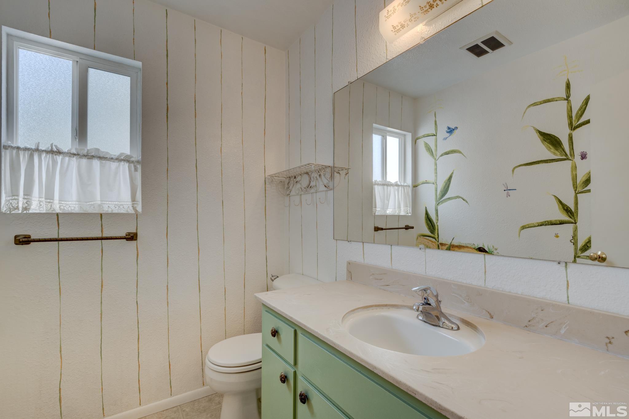 1700 O Farrell Street Reno, NV 89503 - Photo 7 of 22 a bathroom with a sink toilet and shower