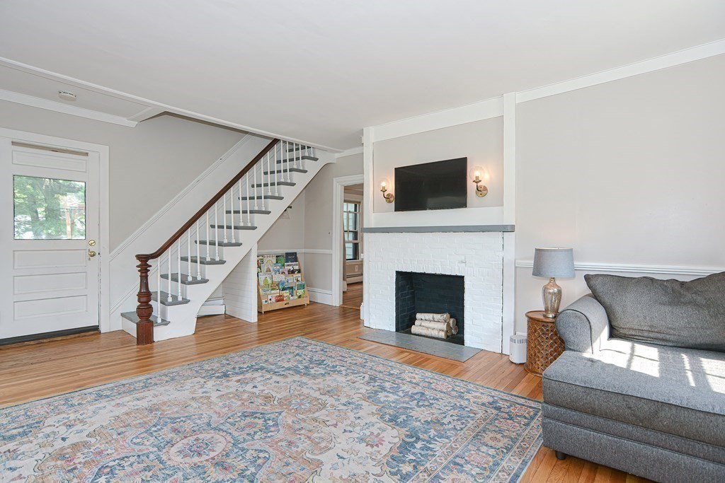 53 Frairy Street Medfield, MA 02052 - Photo 13 of 42 a living room with furniture and a fireplace