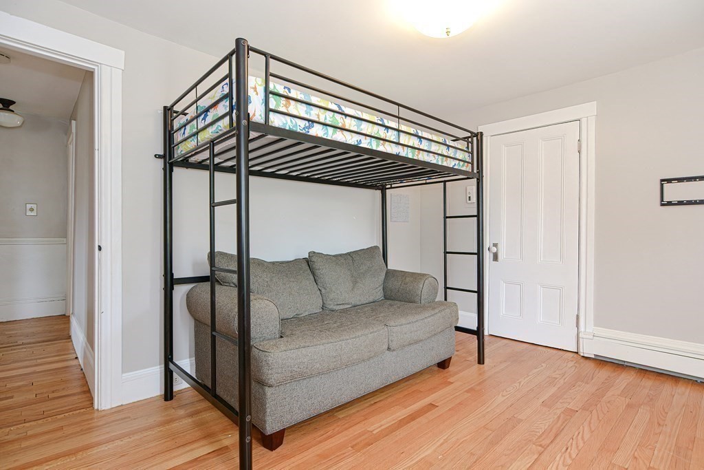 53 Frairy Street Medfield, MA 02052 - Photo 16 of 42 a living room with furniture and a wooden floor