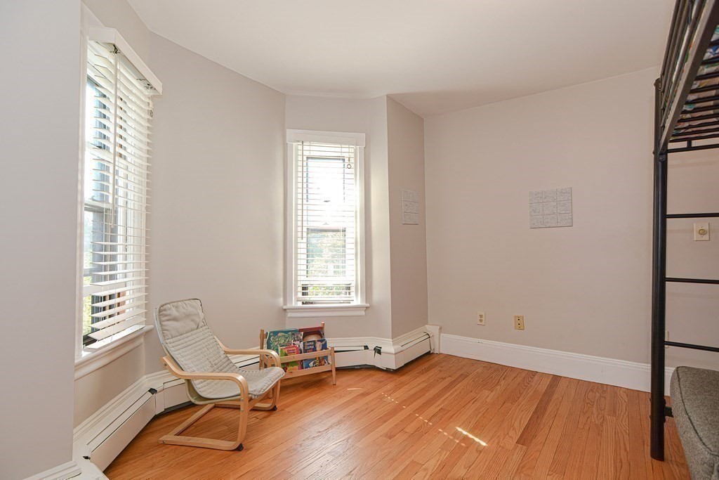 53 Frairy Street Medfield, MA 02052 - Photo 17 of 42 a view of a livingroom with lounge chair and a window