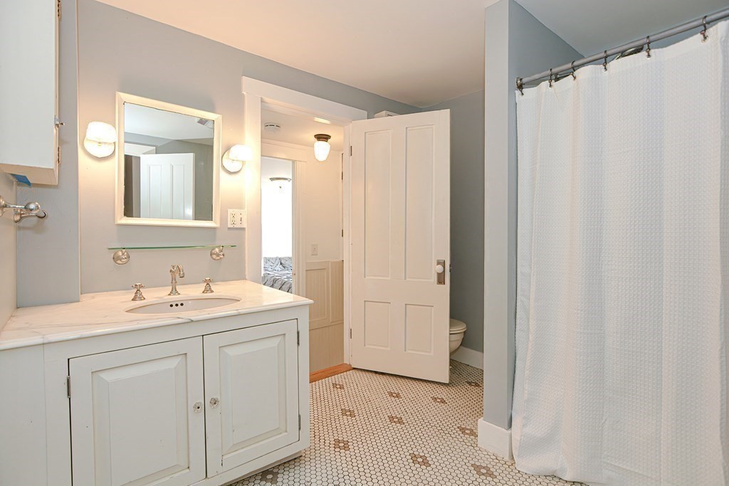 53 Frairy Street Medfield, MA 02052 - Photo 19 of 42 a bathroom with a sink and a mirror