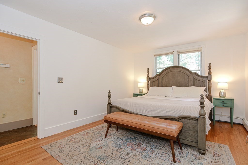 53 Frairy Street Medfield, MA 02052 - Photo 20 of 42 a bedroom with a bed and wooden floor