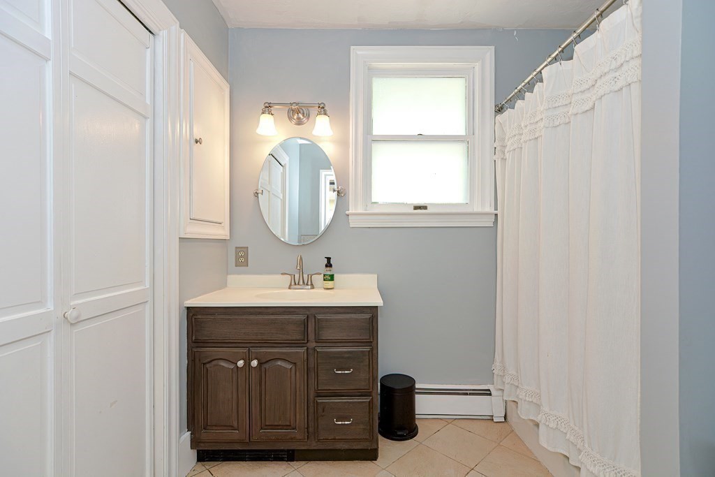 53 Frairy Street Medfield, MA 02052 - Photo 22 of 42 a bathroom with a sink a vanity and a mirror