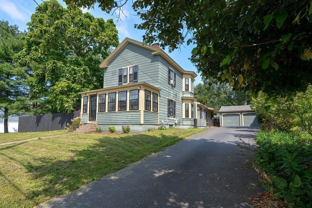 53 Frairy Street Medfield, MA 02052 - Photo 24 of 42 a front view of a house with a yard and trees