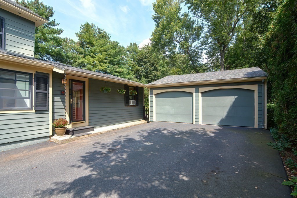 53 Frairy Street Medfield, MA 02052 - Photo 27 of 42 a front view of a house with a garage