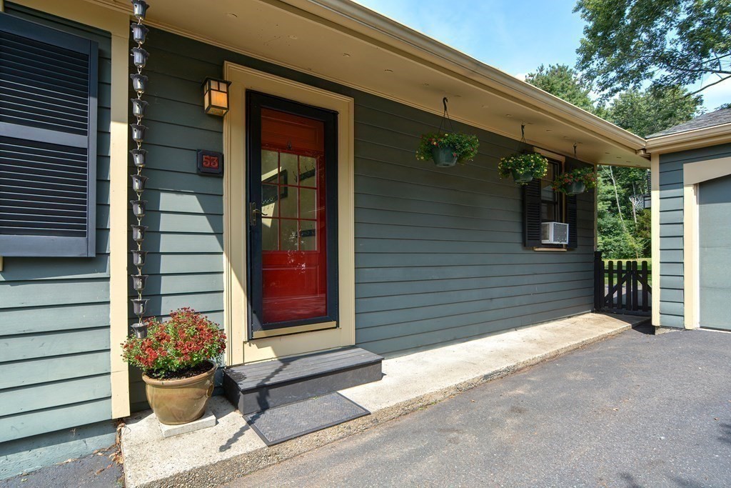 53 Frairy Street Medfield, MA 02052 - Photo 28 of 42 a view of a porch with a chair