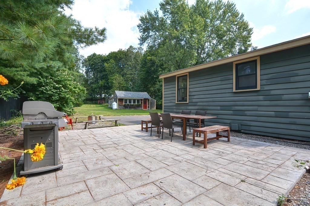53 Frairy Street Medfield, MA 02052 - Photo 32 of 42 a backyard of a house with seating space