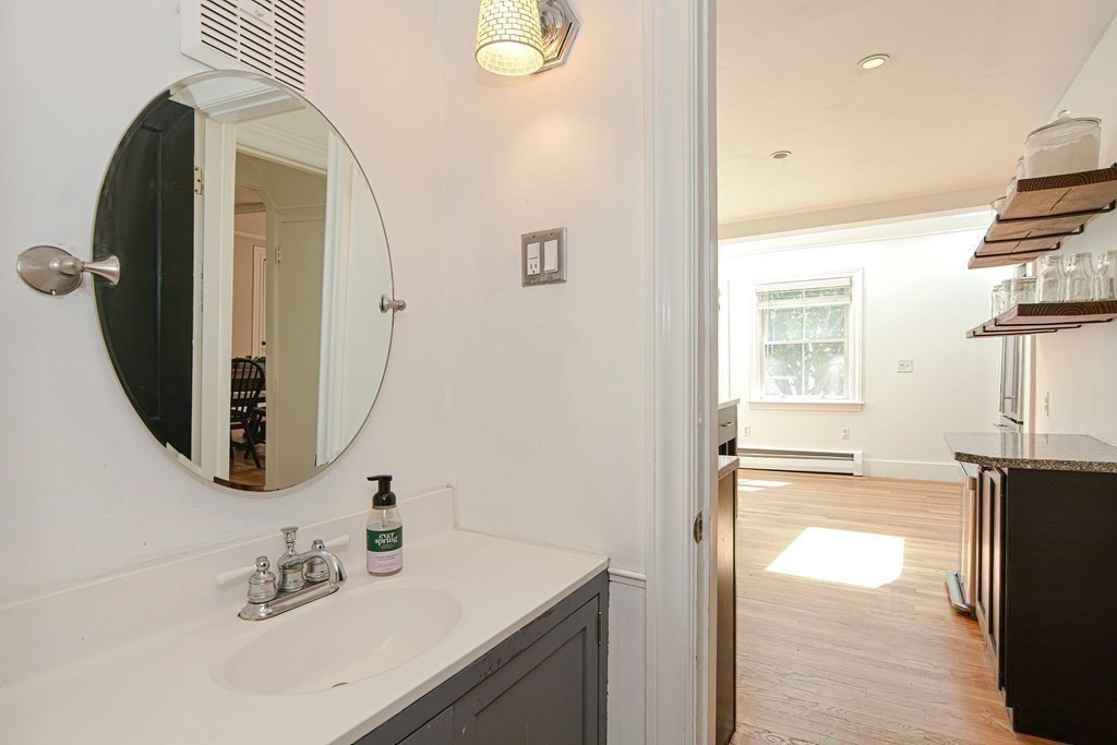 53 Frairy Street Medfield, MA 02052 - Photo 7 of 42 a bathroom with a sink a vanity and a mirror