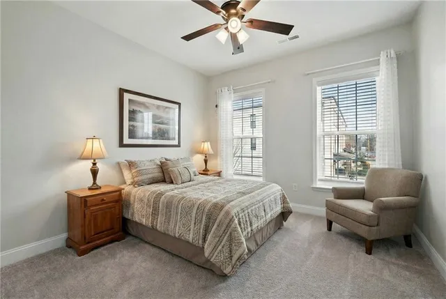 a bedroom with a bed and a couch