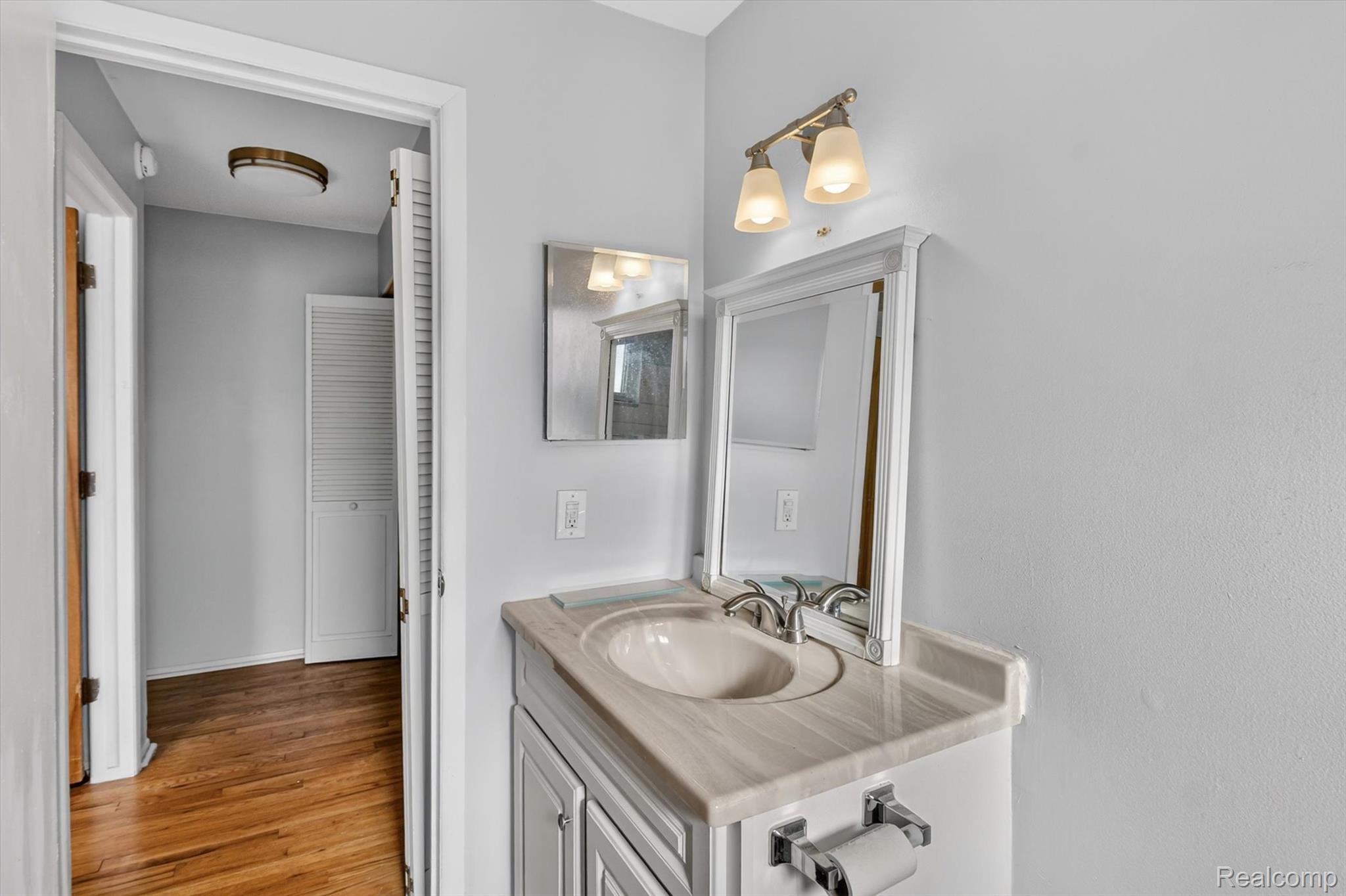 25301 Five Mile Road, Unit 109 Redford, MI 48239 - Photo 18 of 22 Bathroom featuring vanity and light wood finished floors