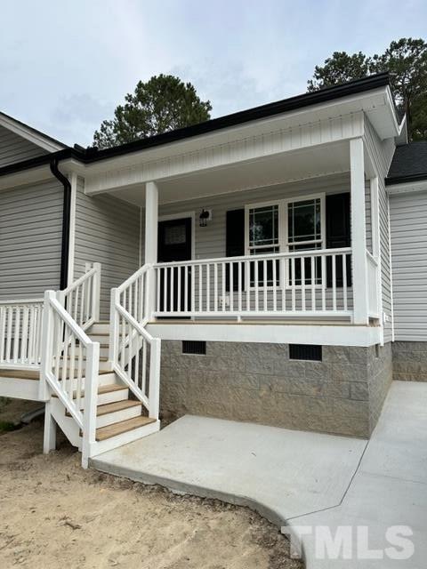 404 Pineview Road Clinton, NC 28328 - Photo 14 of 16 a view of a house with a wooden deck