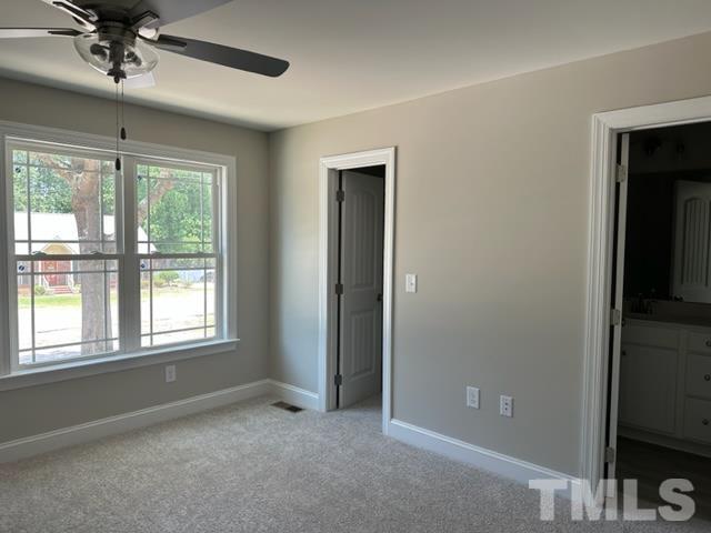 404 Pineview Road Clinton, NC 28328 - Photo 4 of 16 a view of an empty room with a window