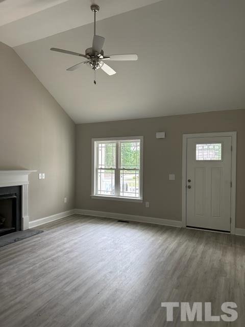404 Pineview Road Clinton, NC 28328 - Photo 7 of 16 an empty room with wooden floor fan and windows
