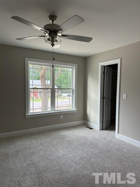 404 Pineview Road Clinton, NC 28328 - Photo 9 of 16 a view of a livingroom with a ceiling fan and window