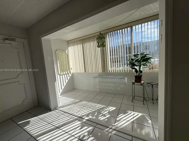 a bathroom with a sink a mirror and a shower