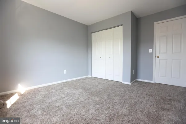 a view of an empty room and entryway