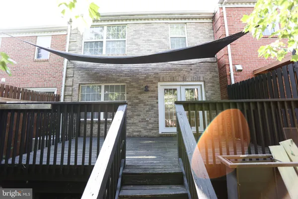 a view of balcony with wooden floor and outdoor seating