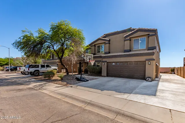 a view of a car parked in front of a house